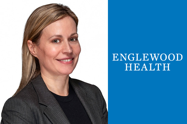 woman in black suit blonde hair