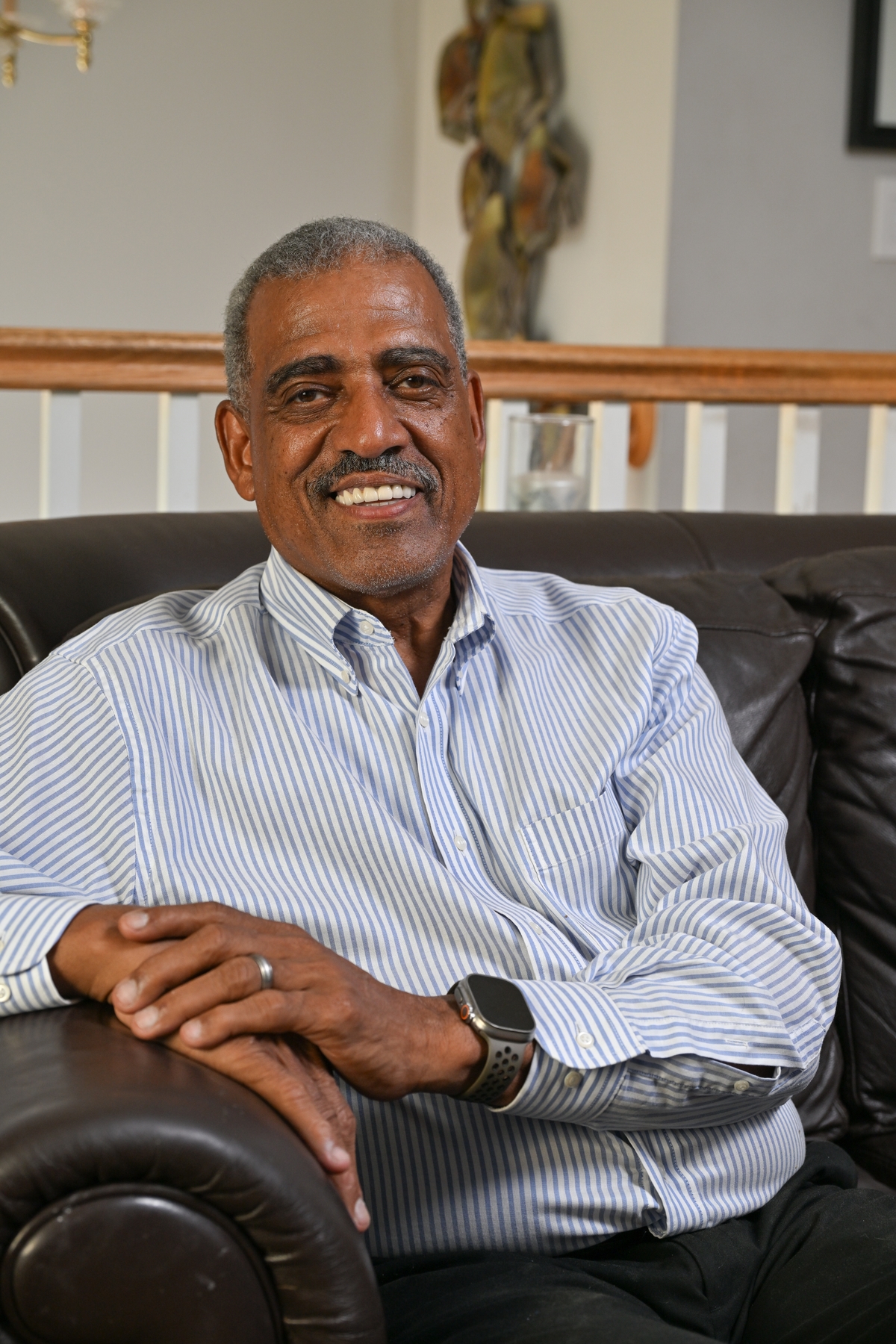 An older man in a casual portait in a home setting