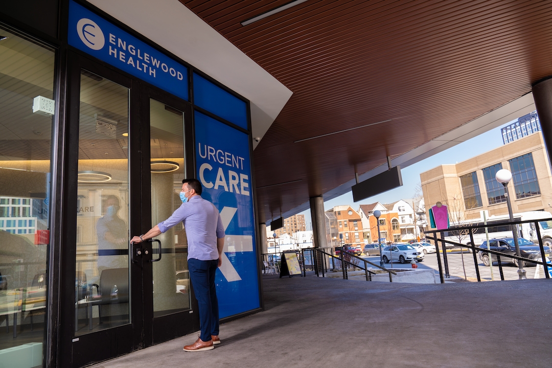 a man walking into a urgent care office