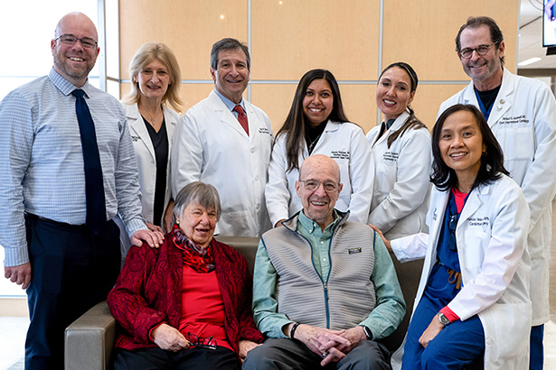 group photo of the patient's team and the patient