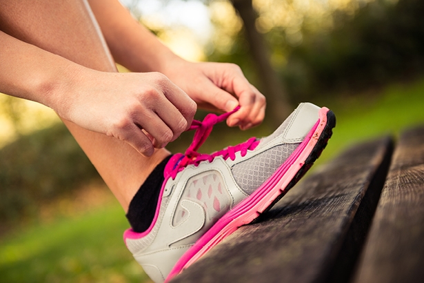 Woman tying laces on sneaker